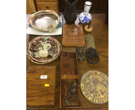 A pair of brass plaques; various pottery; a wall clock etc.