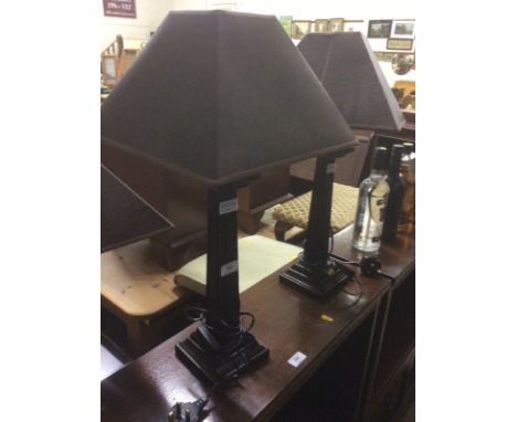 A pair of wooden table lamps and shades; and matching standard lamp