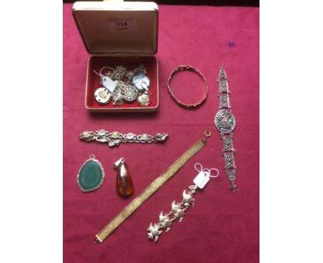 An amber and white metal mounted pendant; a rolled gold bangle and various other jewellery 