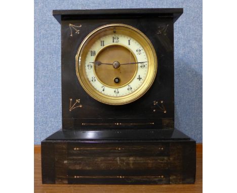 A 19th Century French Belge noir mantel clock and warming pan