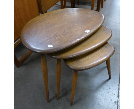 An Ercol pebble shaped nest of tables