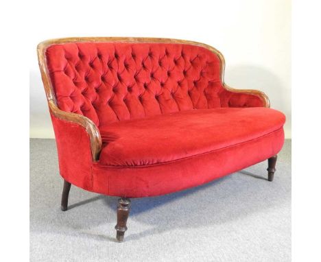 A Victorian red upholstered button back sofa, on turned legs153w x 95d x 93h cm