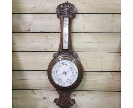 A 1930s walnut cased mantel clock, 50cm wide, together with another smaller and an oak cased aneroid barometer, 82cm high (3)