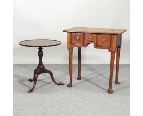 An 18th century lowboy, containing three drawers, above a shaped apron, 68cm, together with a 19th century tripod table (2)68