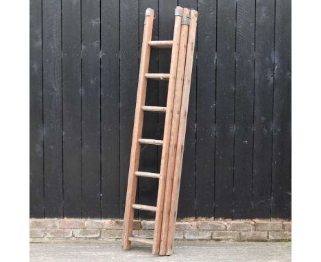 A wooden ladder, in three sections, each 190cm 