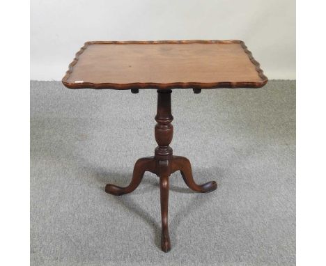 A Victorian mahogany occasional table, with a shaped top, on a splayed tripod base63 x 50 x 61h cmComplete and usable. The to