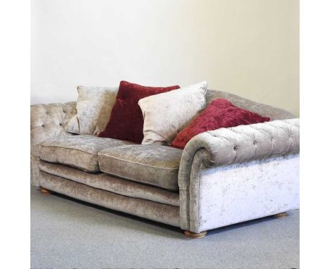 A modern crushed velvet button back sofa, with loose cushions240w x 106d x 75h cm