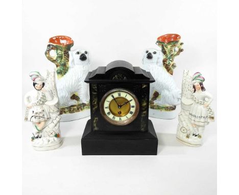 A Victorian black slate mantel clock, together with four Staffordshire figures, highest 34cm (5)