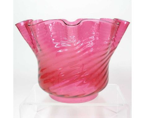 A red glass oil lamp shade, of frilled shape