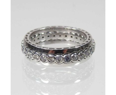 An 18 carat white gold diamond full hoop eternity ring, composed of three connecting bands, 7.1g, size M/N