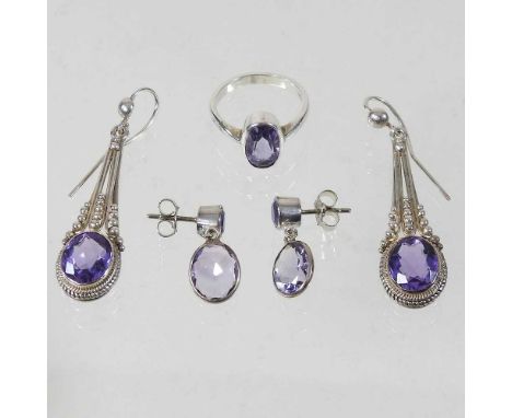 A pair of silver and amethyst earrings, together with another pair, smaller and a ring, boxed (3)