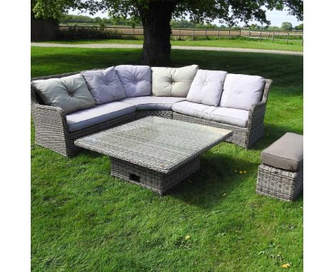 A rattan garden corner sofa, with loose cushions, together with table, with adjustable height and a stool, with cushion seat,