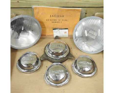 A set of four Jaguar E type chrome wheel centres, together with two headlights (2)