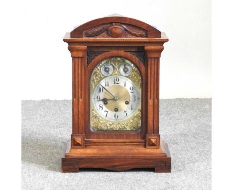 Amended - An Edwardian walnut mantel clock, 45cm high