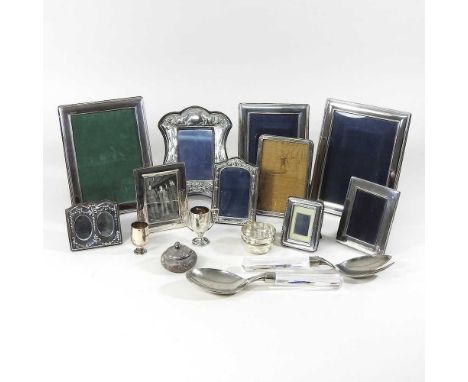 A collection of photograph frames, to include silver and cutleryThe frames are mainly modern and are hallmarked silver and us