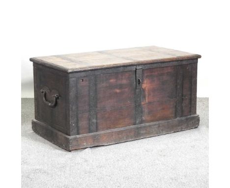 Amended -  A large 19th century continental metal bound oak trunk, with a hinged lid, flanked by carrying handles125w x 66d x