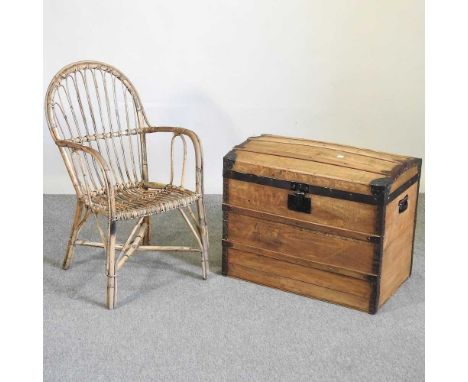 An iron bound dome top pine trunk, 70cm wide, together with a wicker chair (2)