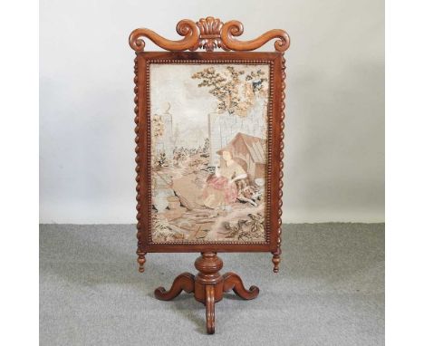 A Victorian carved mahogany and tapestry fire screen, 102cm high