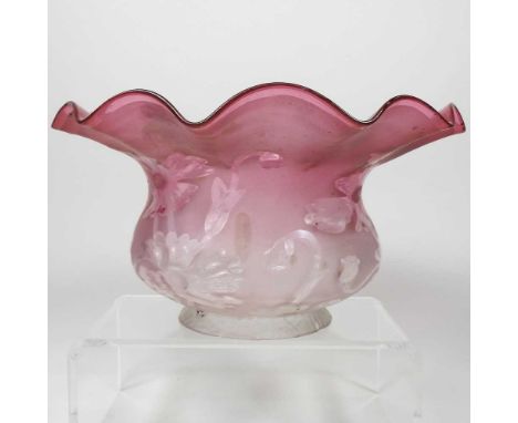 A red glass oil lamp shade, with floral decoration, 