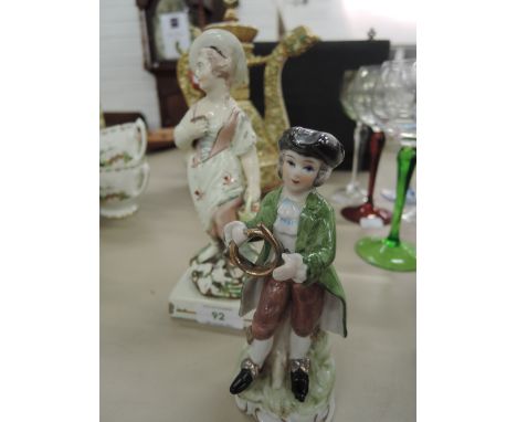 An early 19thc entury pottery figure modelled as peasant woman with basket and a late 20th century ceramic figure