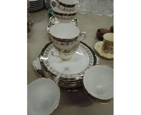 A Royal Stafford tea service having green and gilt decoration