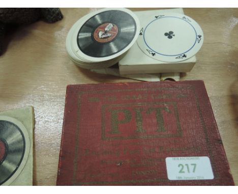 A vintage card game, Pit, and a set of circular playing cards, His Master Voice