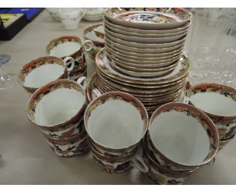 A late 19th early 20th Stafforshire part tea service of chinoiserie design