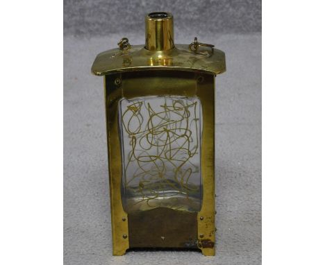 A vintage handled brass singing decanter with abstract design to glass. Plays Little Brown Jug. H.25cm 