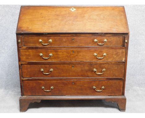 A Georgian mahogany bureau with fall front revealing fitted interior above four graduating drawers on bracket feet. H.108 W.1