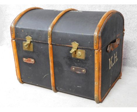 An antique teak and brass bound steamer trunk with twin leather carrying handles. H.62 W.80 D.53cm 