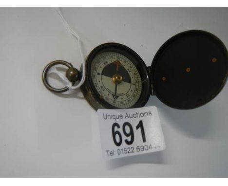 A WW1 brass compass Rd, No, 355639 (circa 1900 onwards) by F Barker &amp; Son makers London.