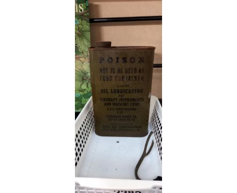 A WW2 USAAF lubricating oil tin and contents for aircraft instruments and machine guns and a military vehicle inspection lamp