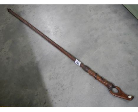 A Welsh style walking stick with carved top.