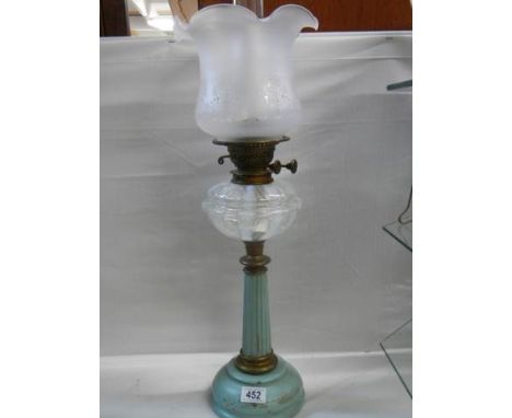 A Victorian brass and metal oil lamp with opaque glass font, Duplex burner and later shade. COLLECT ONLY.