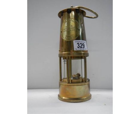 A 20th century brass miner's lamp.