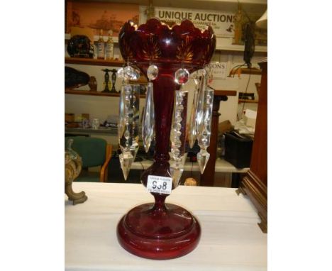 A ruby glass lustre in good condition.