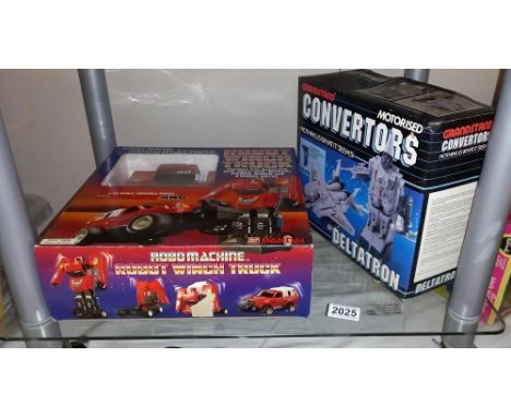 A boxed Bandai robot machine robot winch truck and grandstand motorised convertors deltatron