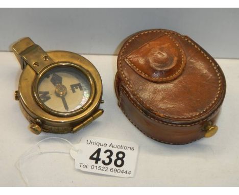 A Swiss made pocket compass in leather pouch, marked Watts &amp; Co., London 1911, No. 782, pouch a/f.