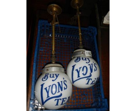 A pair of Lyons Tea hanging gas lamps.  COLLECT ONLY.1 lamp has both chains with on/off brass tags, no burner or mantle, not 