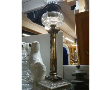 A Victorian silver plate Corinthian column oil lamp in good condition.