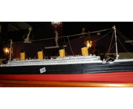 A good model of The Titanic.Looks scratch built.Made of wood.In good condition.Length approximately 110cm No stand, flat bott