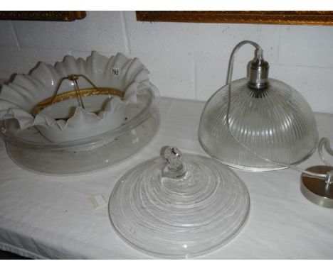 A quantity of glass lamp shades.
