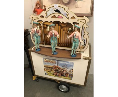 A good travelling organ on stand with carrying case, all figure move, playing tapes from organ music, The Beatles etc., COLLE