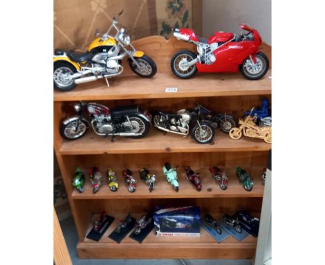 A large collection of die cast & plastic model motorcyclesAll heavily dusty from display so is difficult to judge condition.S
