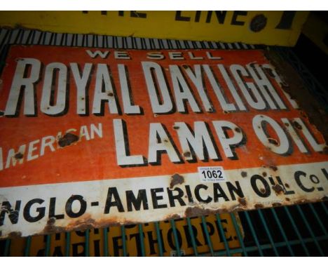 An old metal Royal Daylight Lamp Oil enamel advertising sign.