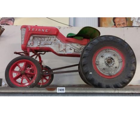 A vintage Tri-ang ride on pedal tractor missing steering wheel COLLECT ONLY 