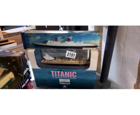 A boxed Minic ships R.M.S. Queen Elizabeth and a boxed model of the Titanic