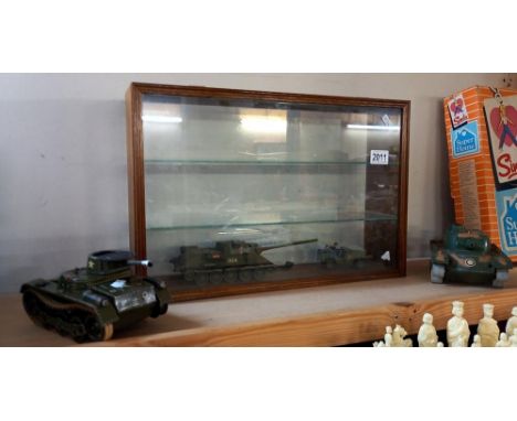 Gama tinplate and Marx plastic military tanks etc and display cabinet