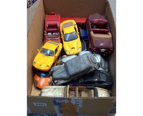 A quantity of large scale die cast model cars, in as found condition