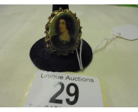 A porcelain portrait brooch in a gilt metal mount.